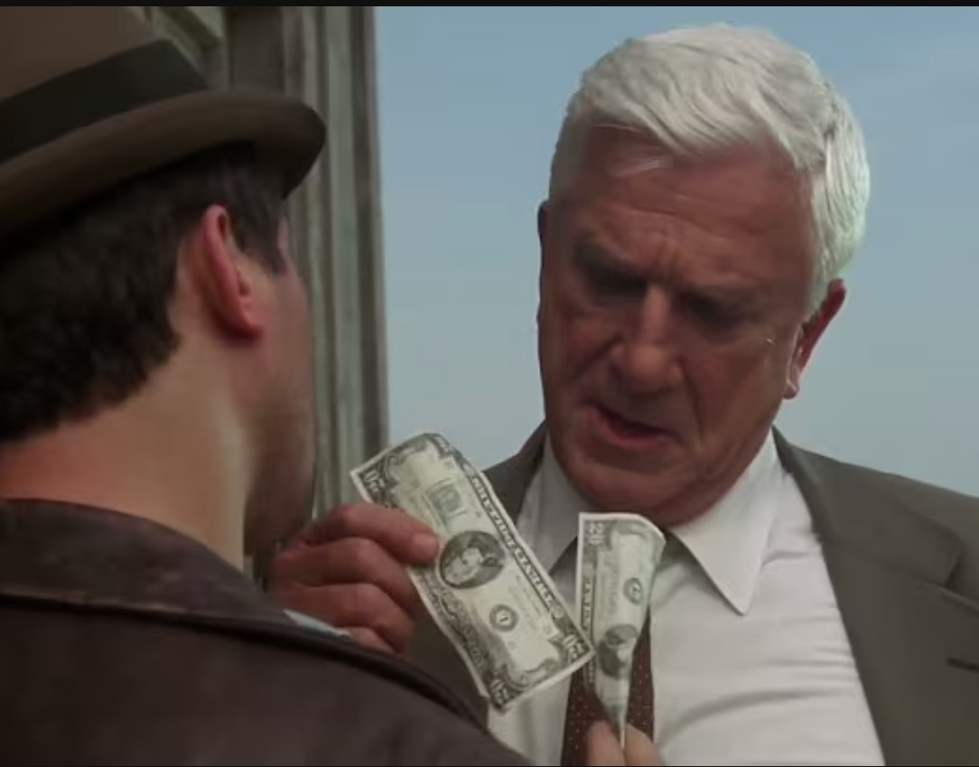 Leslie Nielsen playing the cop in Naked gun, he hands some money to a crook, who hands some money to him, who hands that money back to the crook... who... (this goes on for a while)