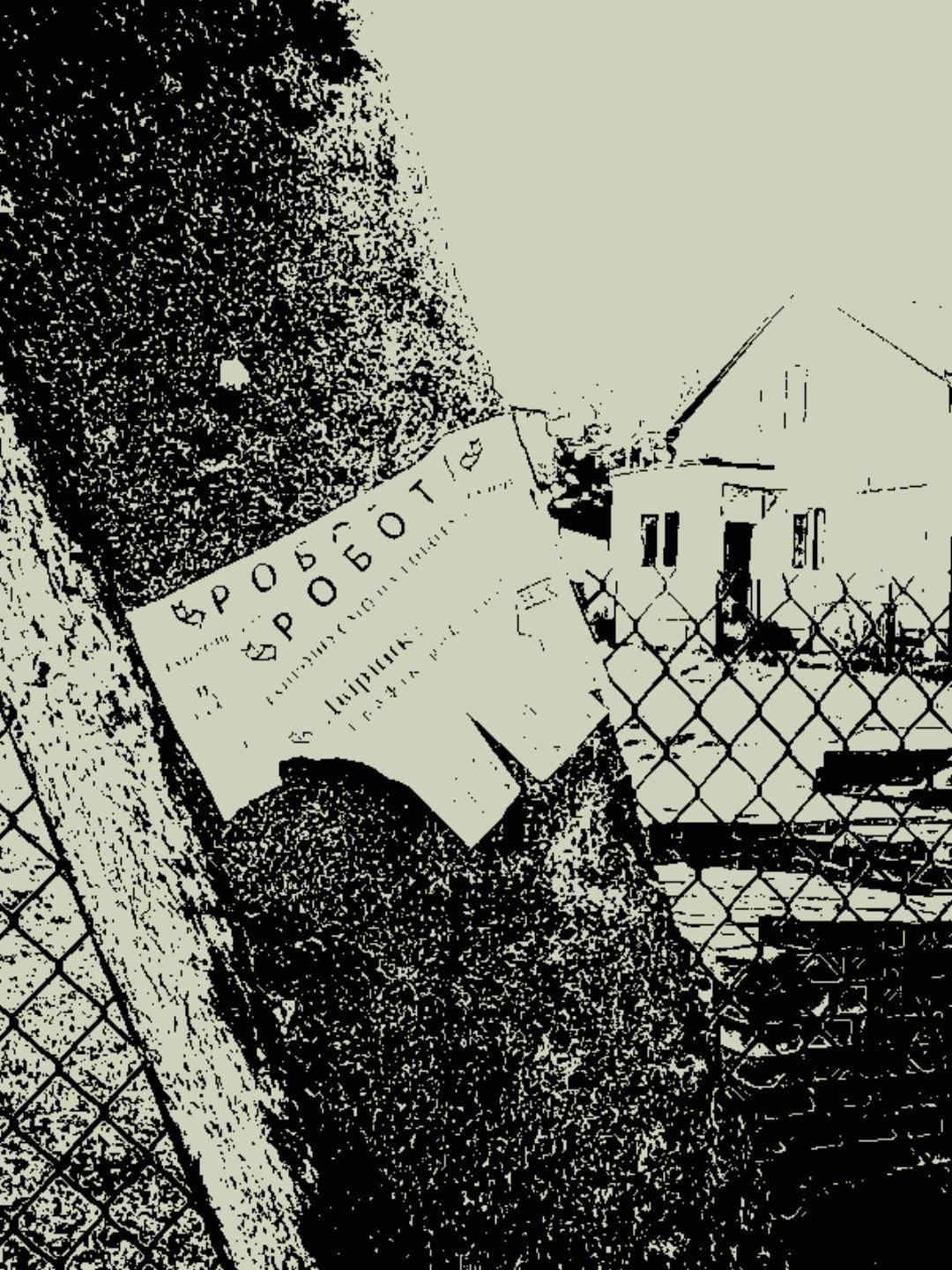 A torn paper notice advertising work is pinned to a rough concrete pole. The sheet is partially peeling away, its edges worn and curling. Behind it, a wire fence and a small house appear faintly through the harsh, high-contrast black-and-white rendering, with heavy grain and posterized textures.