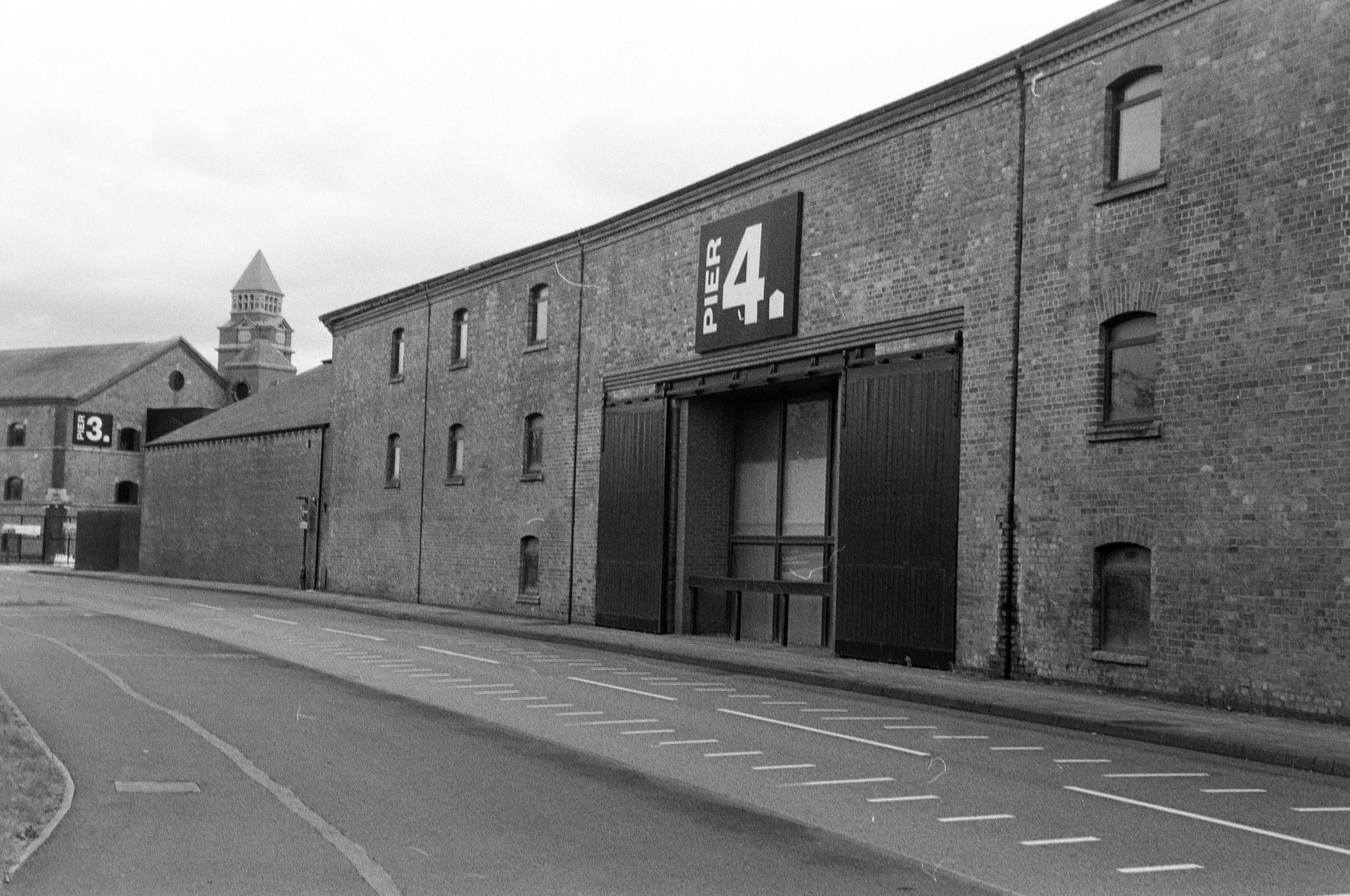 A black and white film photo of Pier 4 at the Wigan Pier Quarter of town.